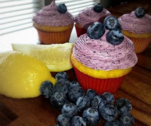 Creamy Lemon Cupcakes With Blueberry Frosting