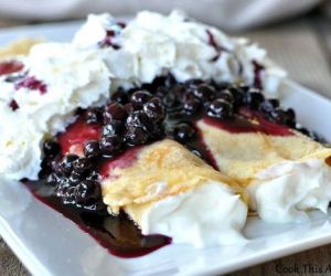 Crepes Smothered in Blueberry Sauce