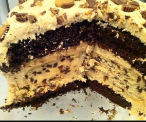 Reese BEAST layered cake with peanut butter cheesecake