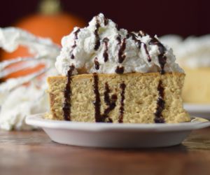 Pumpkin Cheesecake with Gingersnaps Crust and Bourbon Whipped Cream